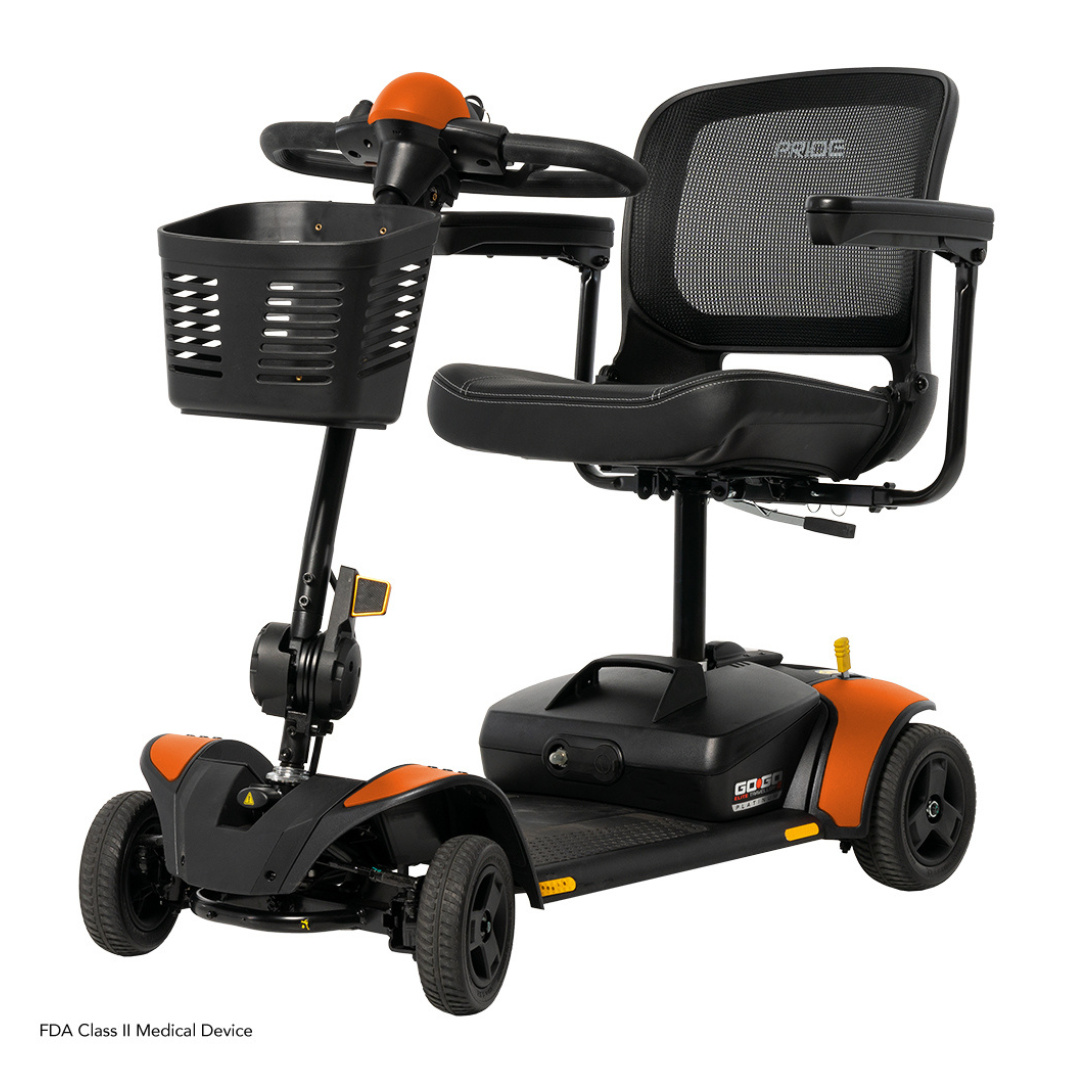 The Pride Mobility Go Go Elite Traveller® 2 Platinum Scooter is a four-wheel black and orange travel scooter featuring a mesh backrest, front basket, comfortable armrests, spacious foot platform, and steering handlebars.